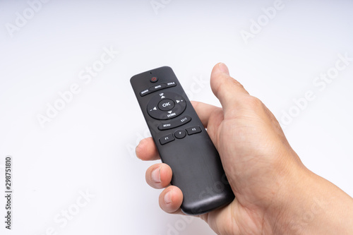 Foto Hand holding a remote control