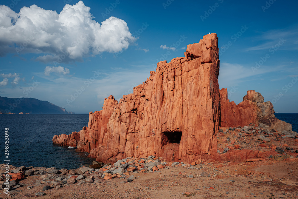 ARBATAX, ITALY / OCTOBER 2019: The scenic red rocks beach in Sardinia, Ogliastra region