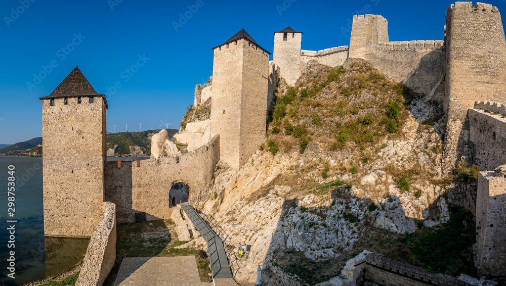 Summer afternoon view of restored medieval Golubac fortress, trdava Golubac  on the bank of the Danube in Serbia for Yugoslavia across from Romania major tourist destination
