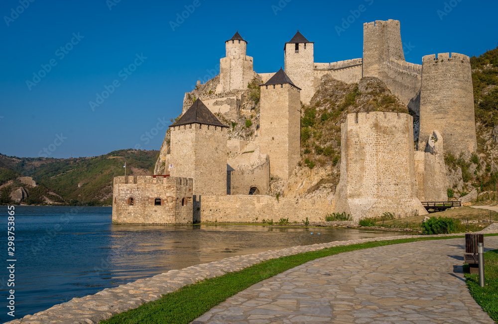 Summer afternoon view of restored medieval Golubac fortress, trdava Golubac  on the bank of the Danube in Serbia for Yugoslavia across from Romania major tourist destination
