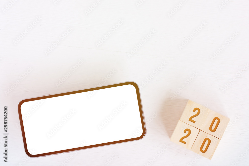 Mock up of smartphone, cubes with numbers new year 2020 with copy space. Toned. Mock up of smartphone, cubes with numbers new year 2020 with copy space. Toned.