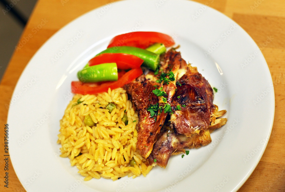Grilled lamp meat with vegetables and rice on the dinner plate Grilled lamp meat with vegetables and rice on the dinner plate