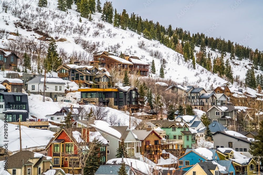 Mountain in Park City Utah with luxury cabins and snow in winter season