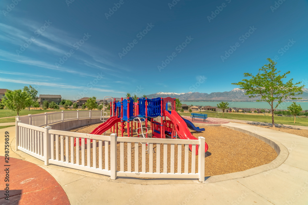 Playground with stunning view of lake and Timpanogis mountains under blue sky
