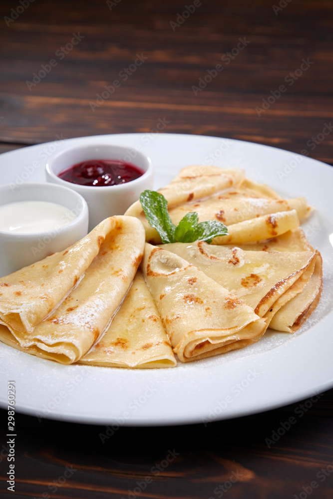 pancakes with sour cream and berry sauce