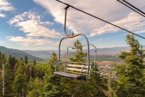 Chairlift overlooking the scenic Park City Utah landscape on a sunny summer day