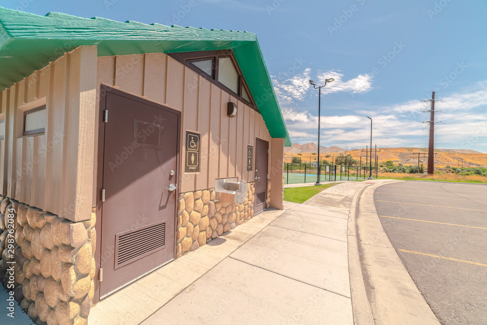 Naklejka premium Toilets at recreational fun park on sunny day