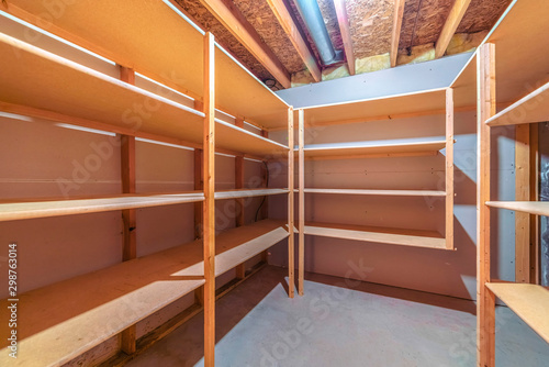 Interior empty shelves of a walk in closet
