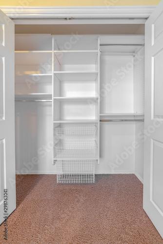 Open double door built in closet looking in