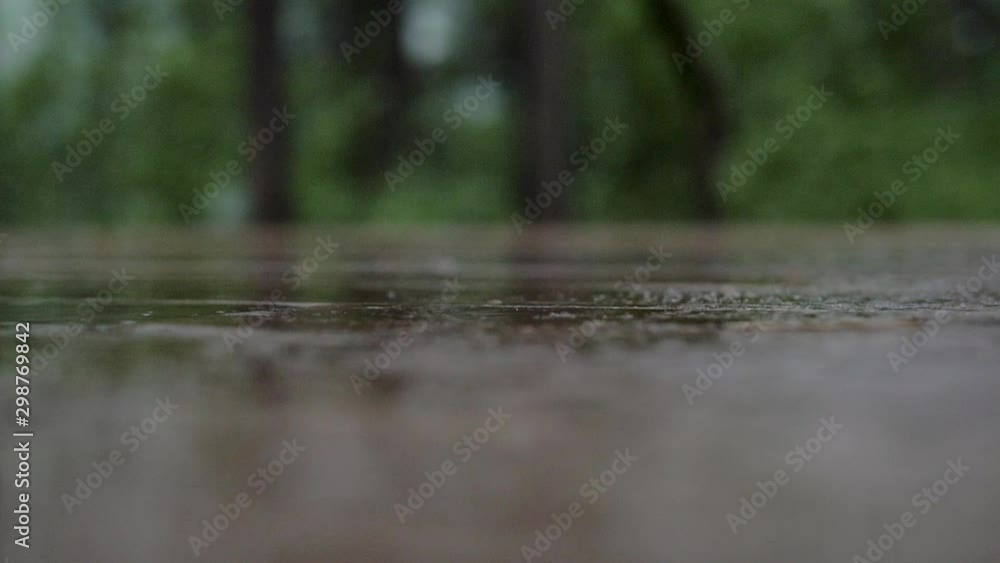 Wet table closeup outside restaurant during heavy rain Wet table closeup outside restaurant during heavy rain