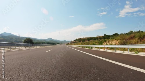 POV, Driving Plate - car driving and changing lanes on a countryside highway road in Bulgaria on a sunny summer day.