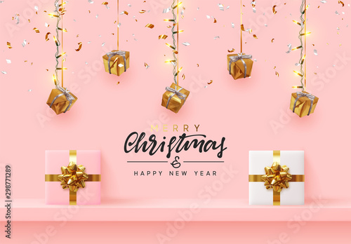 Christmas background. Xmas design hanging from light garland with realistic gift boxes strewn with golden confetti. Handmade calligraphic lettering text Merry Christmas and Happy New Year.