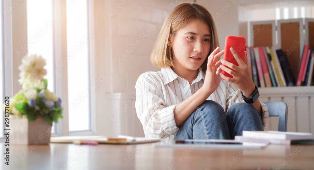 Cropped shot view of Young smiling business woman using smartphone near in office Cropped shot view of Young smiling business woman using smartphone near in office