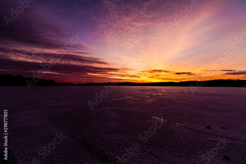 pink winter sunrise at a lake