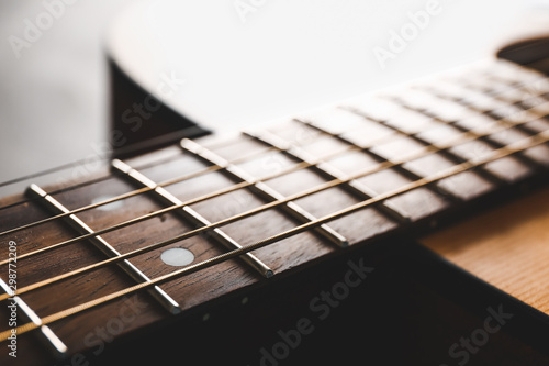 Modern acoustic guitar, closeup view