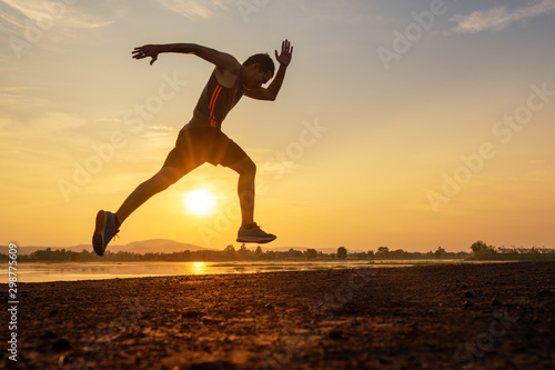 Male action to running exercise on the sunset