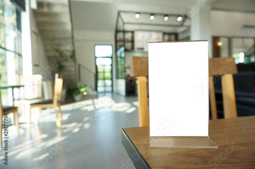 Menu frame standing on wood table in Bar restaurant cafe. space for text marketing promotion.