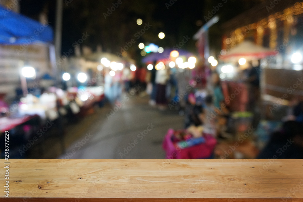 Empty dark wooden table in front of abstract blurred bokeh background of restaurant . can be used for display or montage your products.Mock up for space.