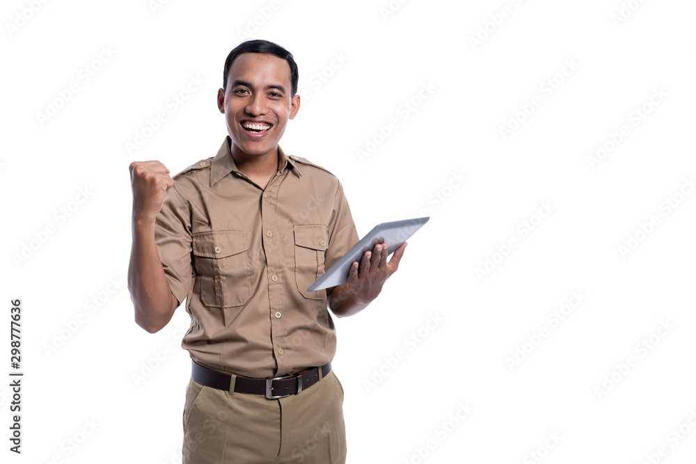 happy indonesian government worker using tabletp pc. businessman using modern device. pegawai negeri sipil happy indonesian government worker using tabletp pc. businessman using modern device. pegawai negeri sipil