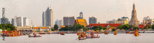 Traitional royal thai boat in river in Bangkok city with Wat arun temple background photo