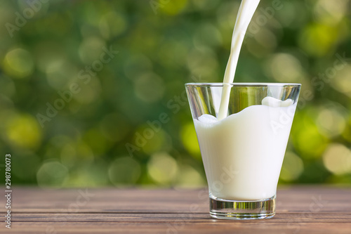 milk pouring into glass