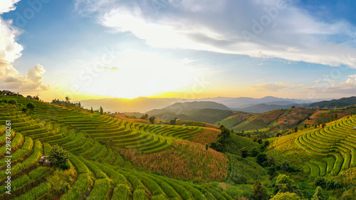 Panorama Aerial view Sunset scene of Pa Bong Piang terraced rice fields, Mae Chaem, Chiang Mai Thailand. Mountain hills valley at morning in asian, Vietnam. Nature landscape background. © AU USAnakul+