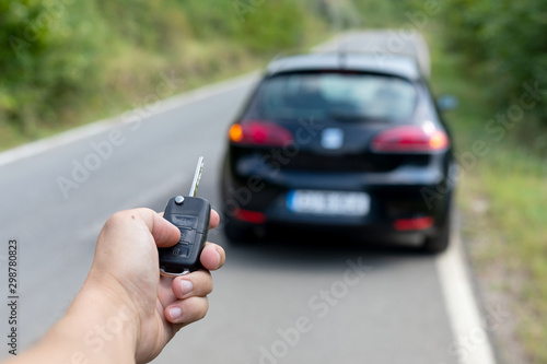 Man holding  car key photo