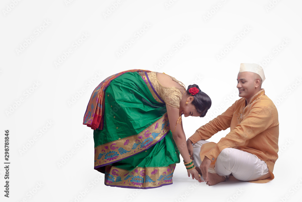 Hindu female touching his feet due respect with hands - Image.