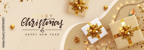 Christmas banner. Background Xmas design of sparkling lights garland, with realistic gifts box, glitter gold confetti. Horizontal New Year poster, greeting card, header, website. Design Flat top view