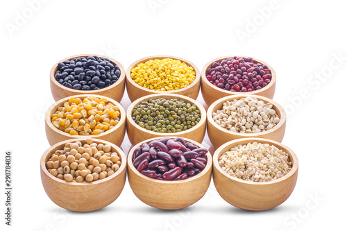Cereal grains , seeds, beans on wooden background