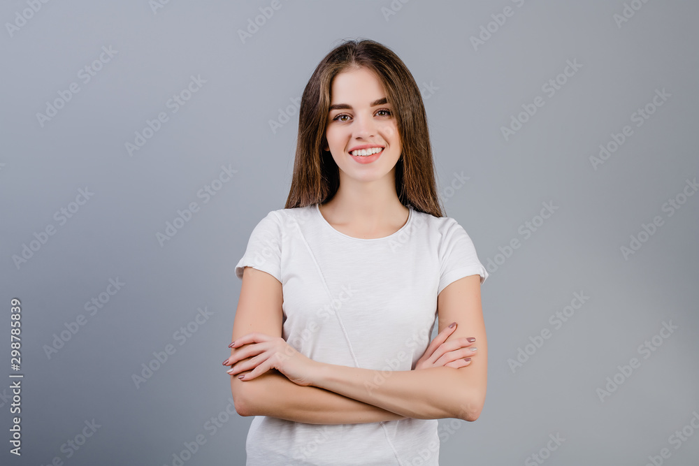 beautiful brunette girl smiling isolated over grey background beautiful brunette girl smiling isolated over grey background