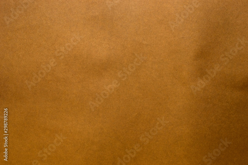 Dark brown paper surface. Suitable for use as a background.