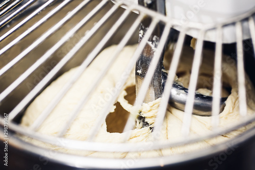 close-up of the dough kneading in a dough mixer.