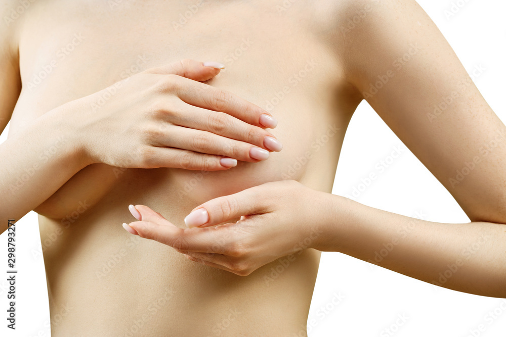 Naked woman examining her breast. Naked woman examining her breast.