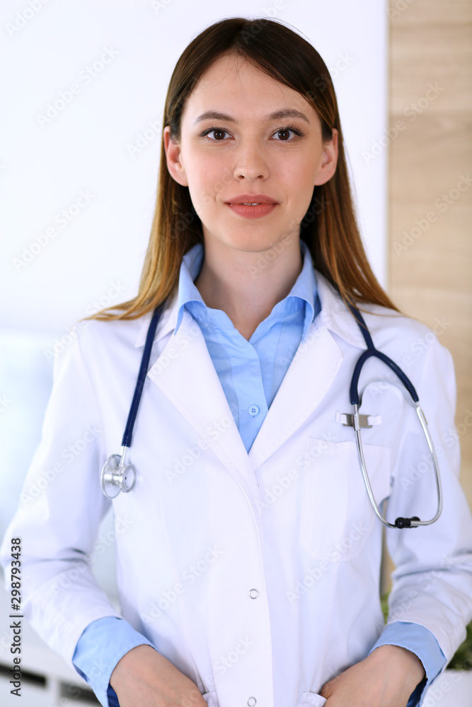 Asian doctor woman happy and cheerful while standing in hospital office. Medicine and health care concept Asian doctor woman happy and cheerful while standing in hospital office. Medicine and health care concept