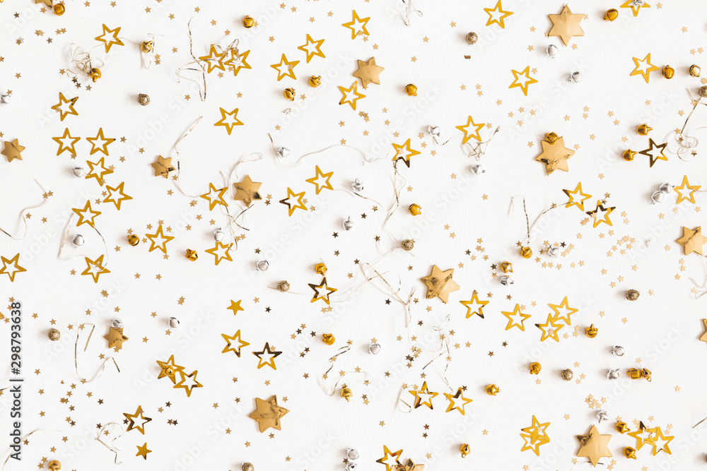 Christmas composition. Christmas golden decorations on white background. Flat lay, top view, copy space Christmas composition. Christmas golden decorations on white background. Flat lay, top view, copy space