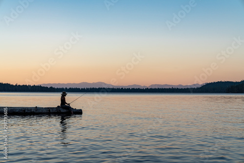Woman Fishing in Lake Tahoe During Sunset © Zach