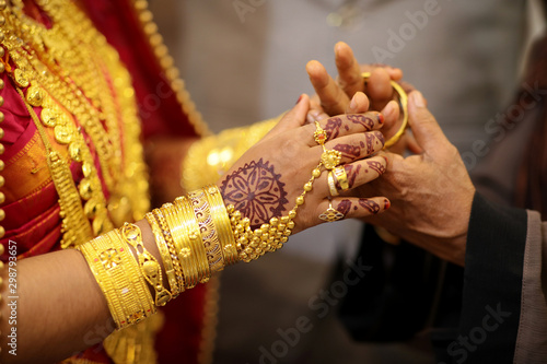 indian bride getting her wedding bangles