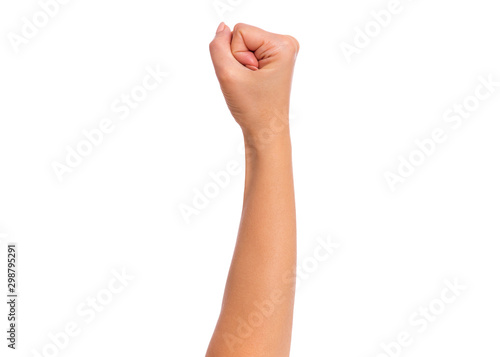 Female hand with fingers folded into fist, isolated on white background. Beautiful hand of woman with copy space.