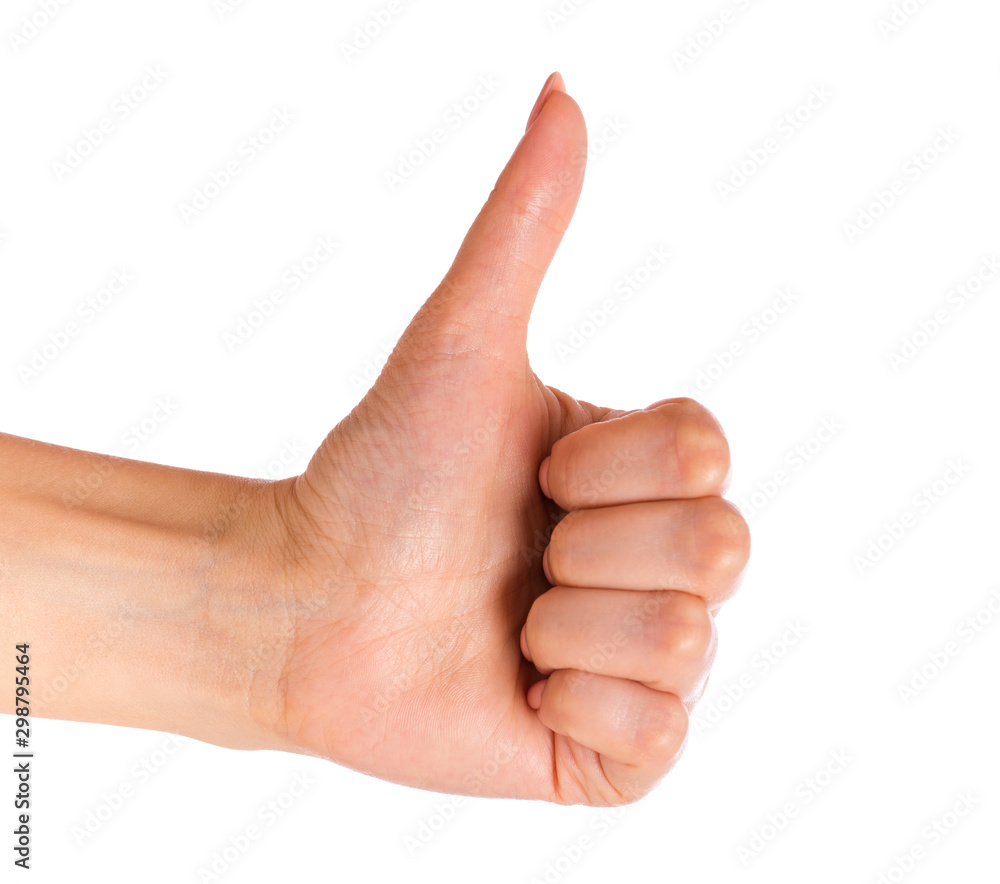 Female hand showing Thumb up gesture, isolated on white background. Beautiful hand of woman with copy space. Female hand showing Thumb up gesture, isolated on white background. Beautiful hand of woman with copy space.