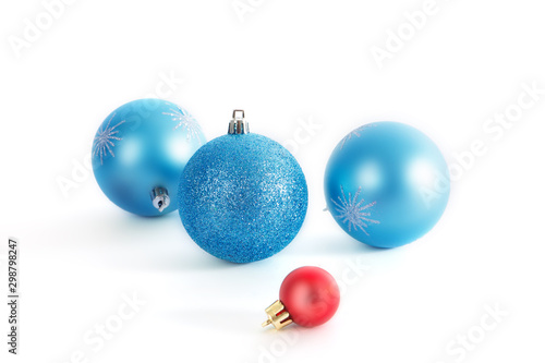 Christmas decorative three christmas blue balls and one red christmas ball on white background
