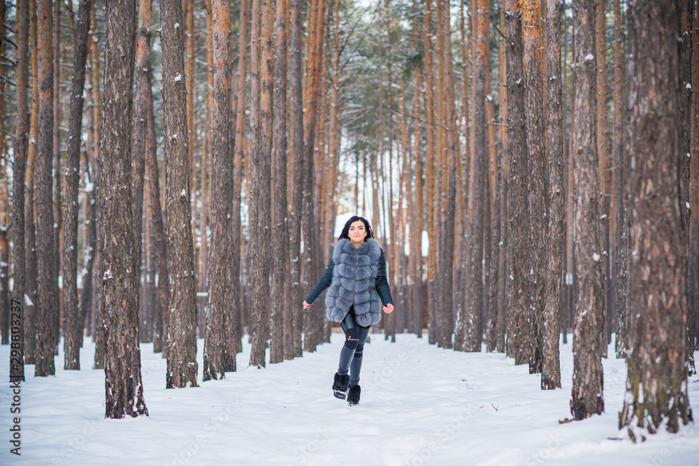 Happy woman at Holiday having fun at winter snowy day, concept of positive mood
