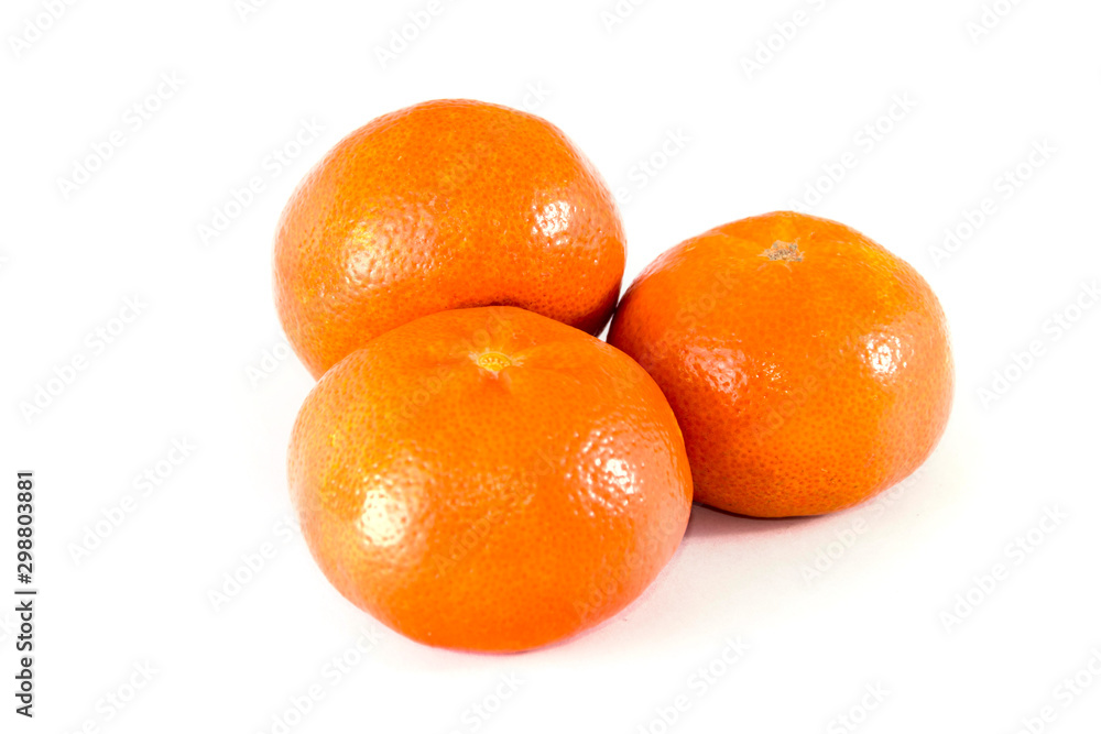 three ripe mandarins isolated on white background. three ripe mandarins isolated on white background.