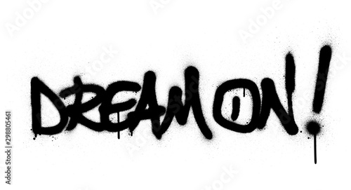 graffiti dream on text sprayed in black over white