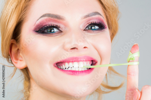 Closeup face  smile. Woman makeup  bubblegum  gum.Bubble chewing girl  bubble gum portrait. Fun female and happy. Makeup beauty and eye make up