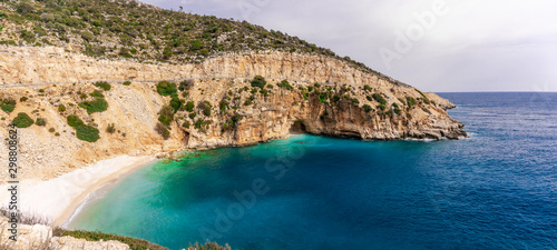 Amazing turquoise beach and cove on the way to Demre - Finike. Detail of cave. Kas, Antalya, Turkey. Summer and holiday background.