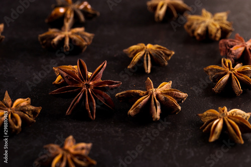 Star anise on black table. Concept, copy space.