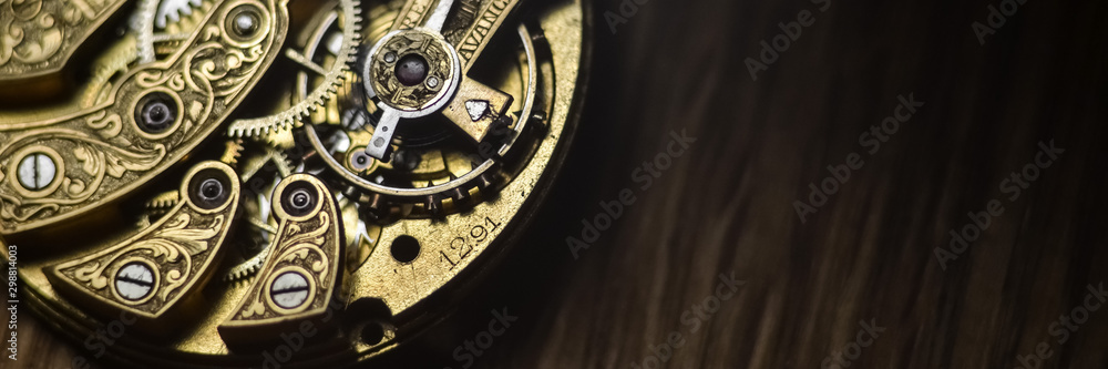  Close up inside mechanical vintage watch. Handmade engraving. Concept eternity, teamwork. Soft focus. Free space for text. Macro. Conceptual photo for your successful business design.