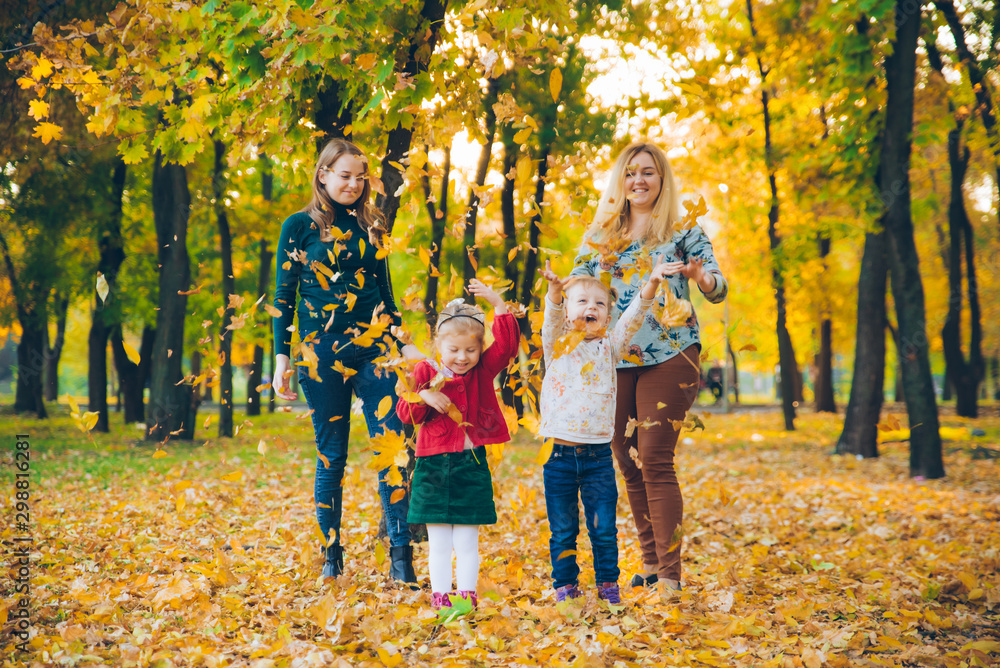 family playing at city park mothers with daughters family playing at city park mothers with daughters