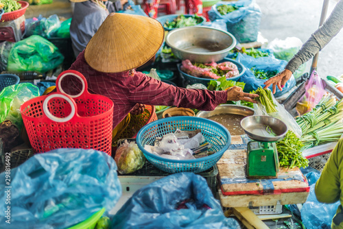 Women selling food on the street of Hoi An, Vietnam